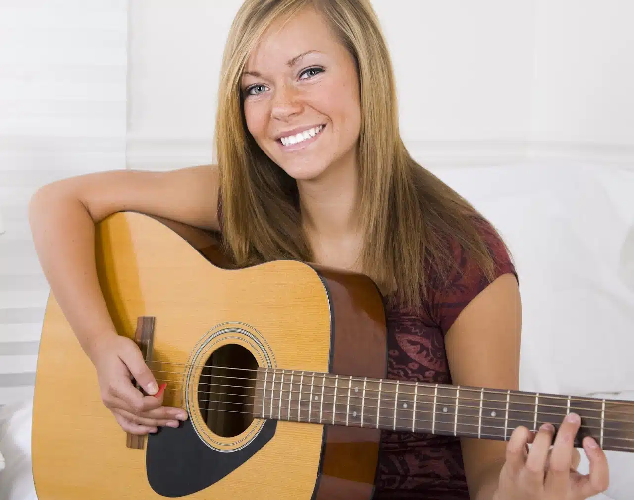 Student taking guitar lessons at Maestro Musicians Cleveland