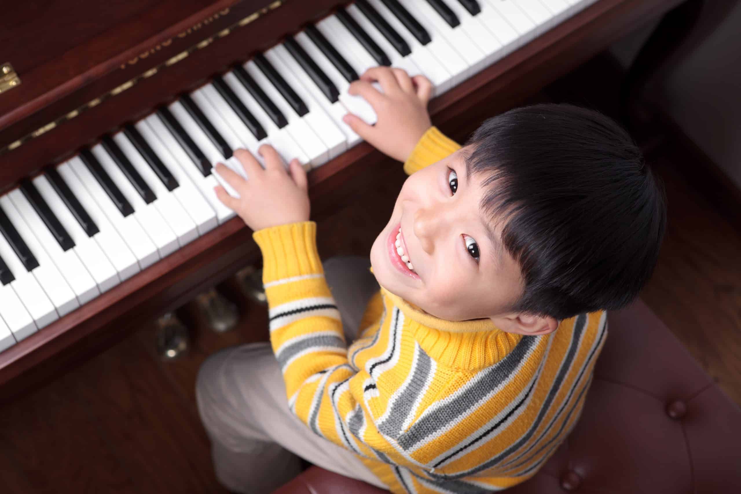Child learning piano