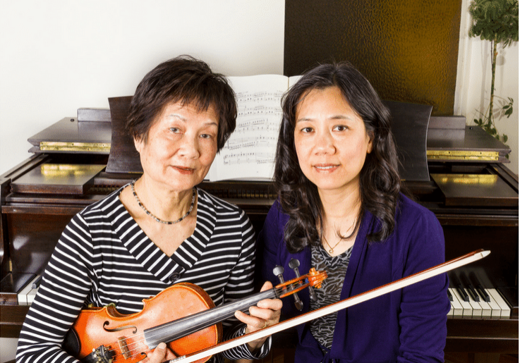 Violin teacher with student