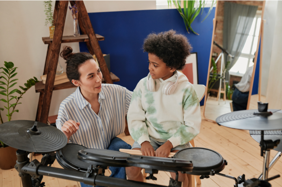 Child taking Drum Lessons Cleveland on electronic kit