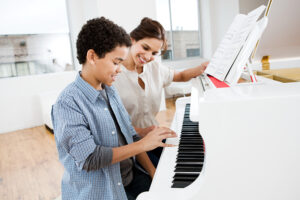 Boy taking piano lessons
