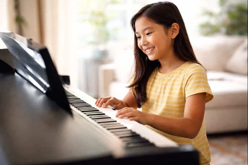 Child gaining confidence through piano lessons